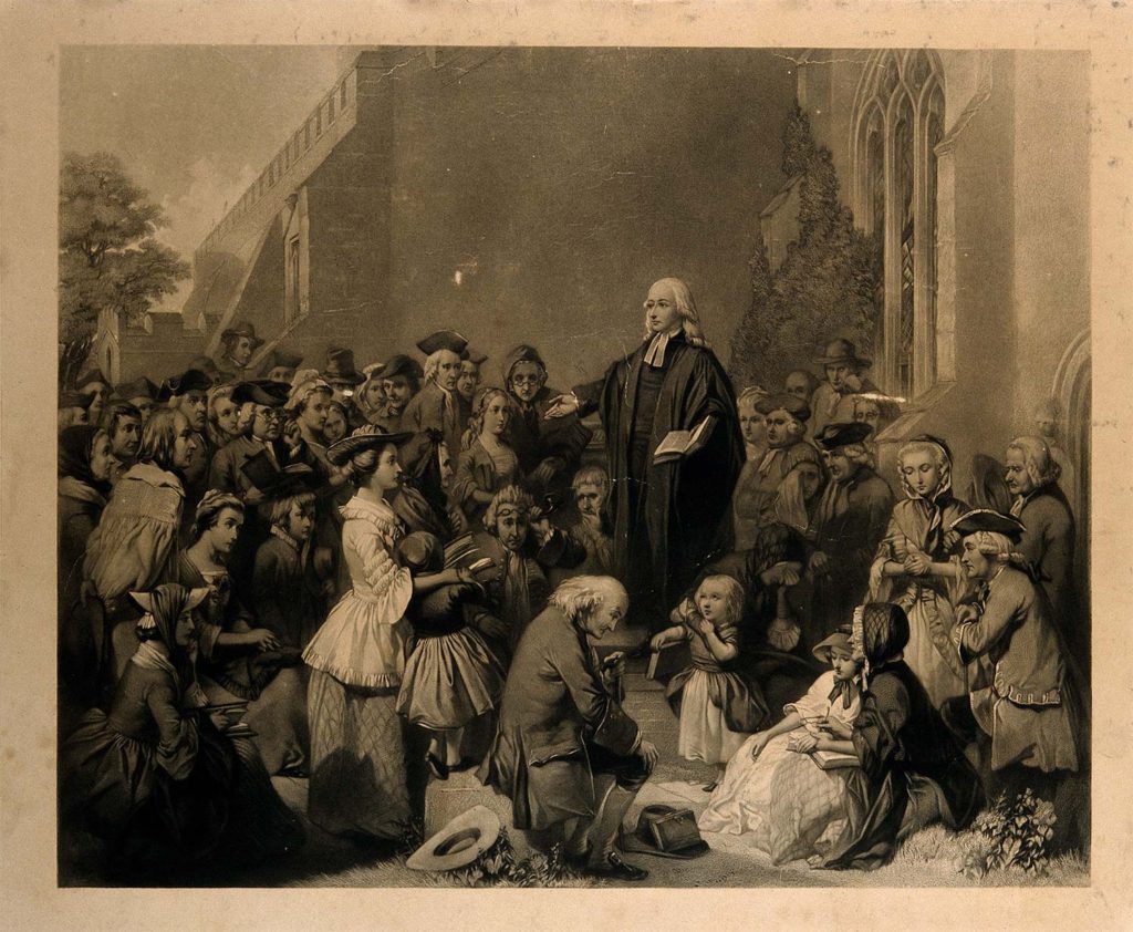 Predicación de John Wesley al aire libre.
